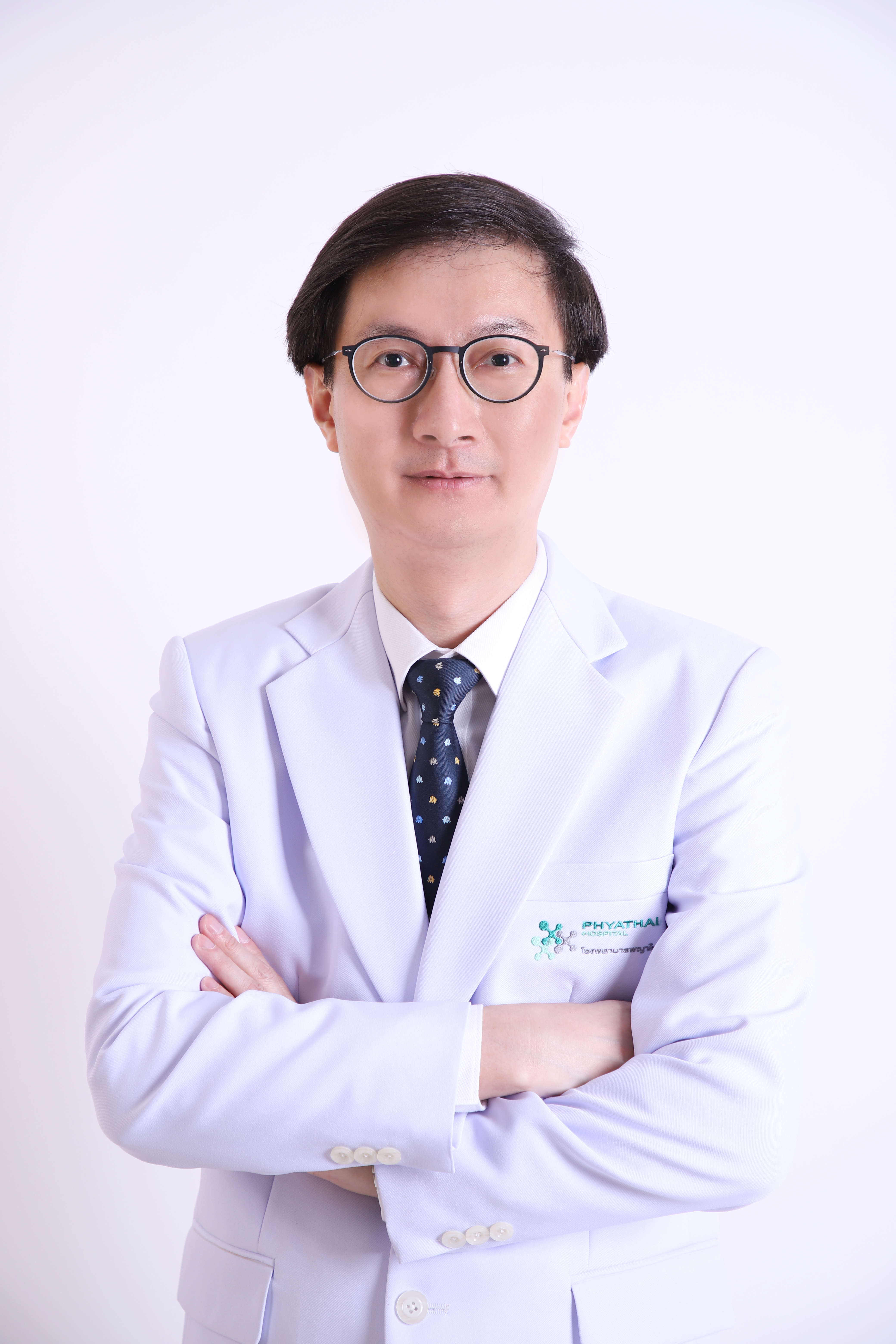 Dr.  Thongchai Paisansinsup